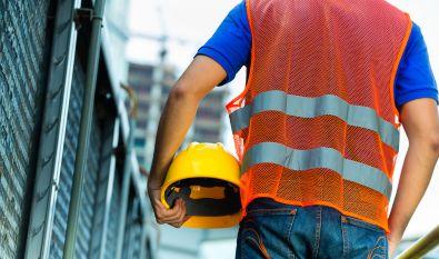 Construction worker on a job-site carrying PPE