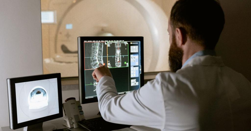 Technician reviewing mri imaging or ct scan imaging of the spine